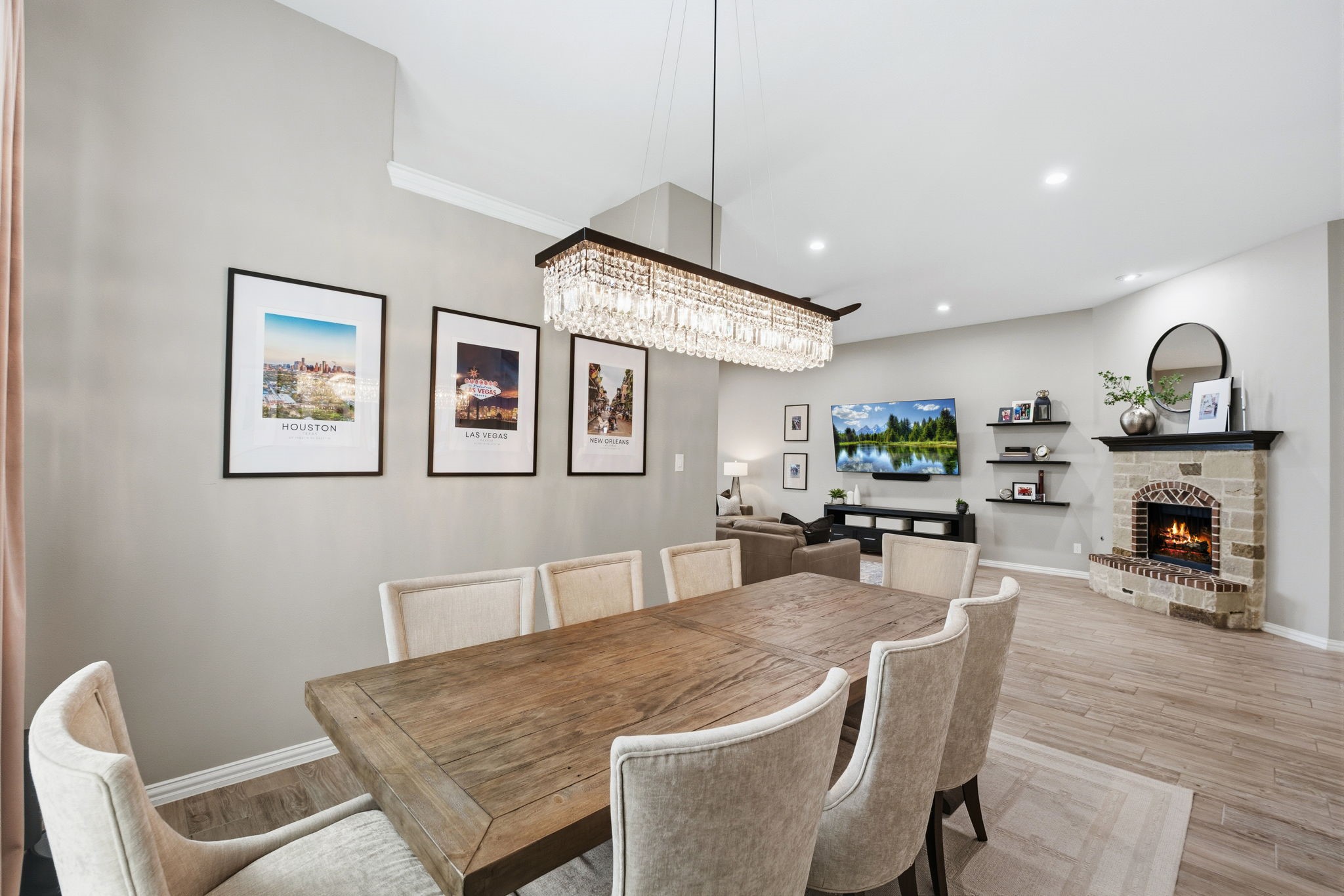 27906 Arden Trail Spring, TX 77386 - Photo 18 of 49 a view of a dining room with furniture a fireplace and wooden floor