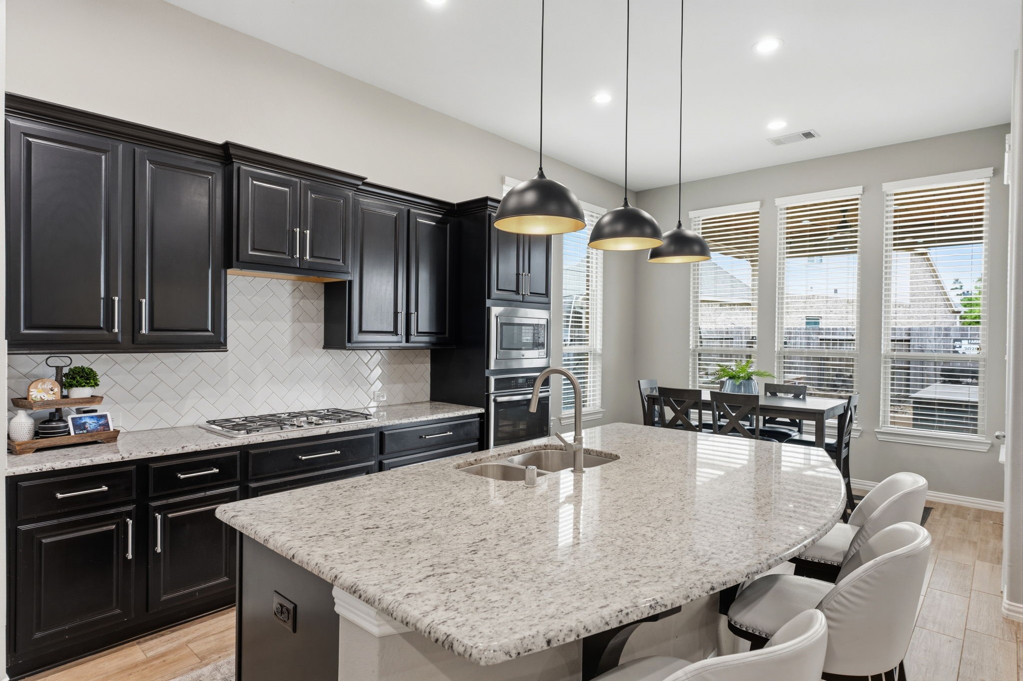 27906 Arden Trail Spring, TX 77386 - Photo 24 of 49 a kitchen with stainless steel appliances granite countertop a sink a stove and a wooden floors