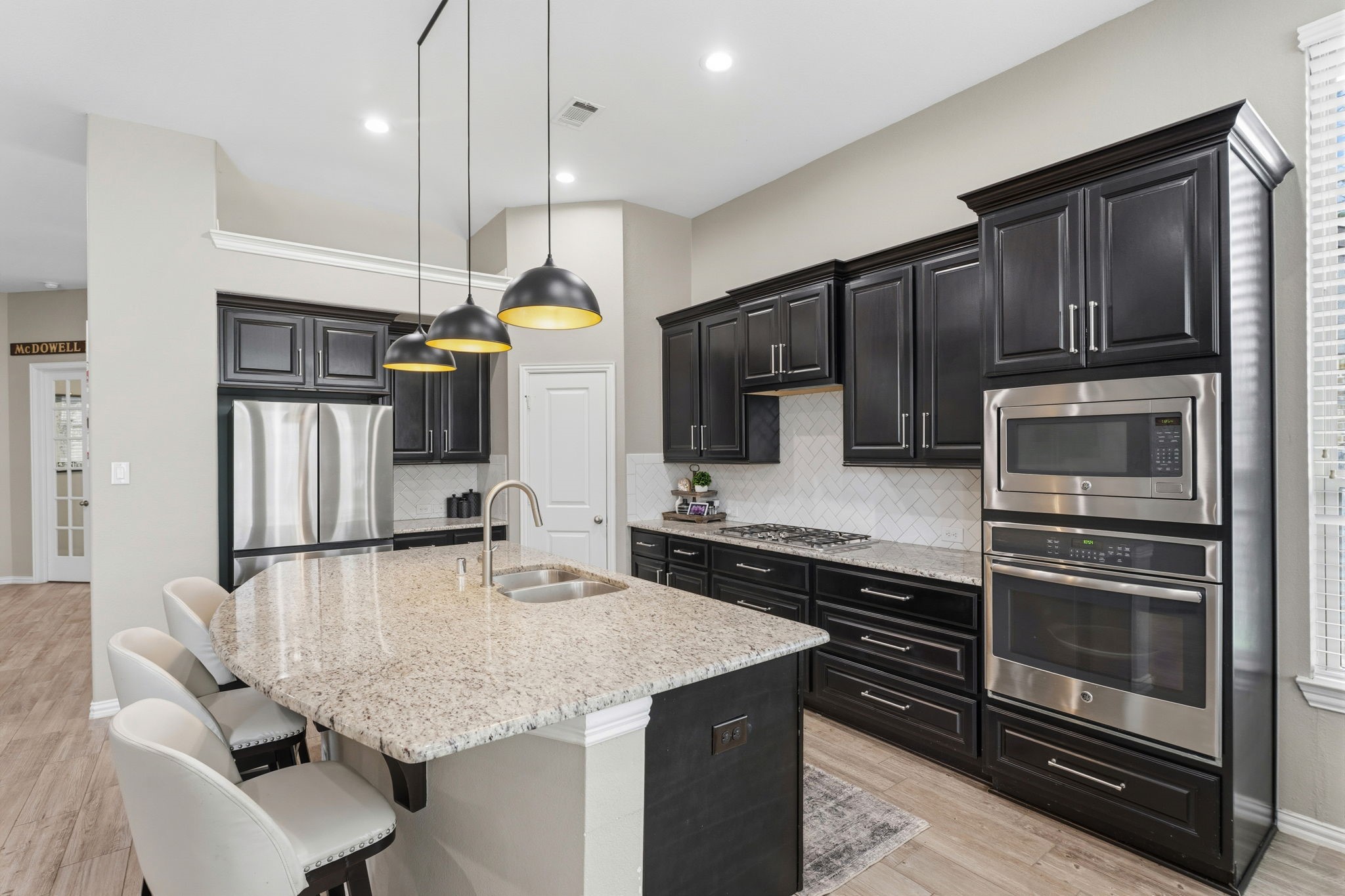 27906 Arden Trail Spring, TX 77386 - Photo 25 of 49 a kitchen with stainless steel appliances kitchen island granite countertop a refrigerator a stove and a sink