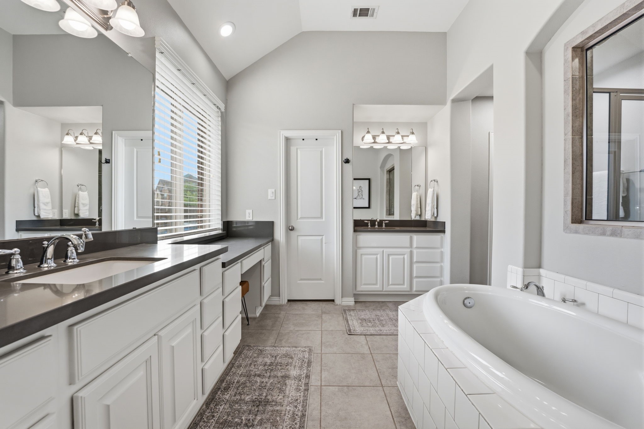 27906 Arden Trail Spring, TX 77386 - Photo 31 of 49 a large bathroom with a granite countertop double vanity sink a bathtub and shower