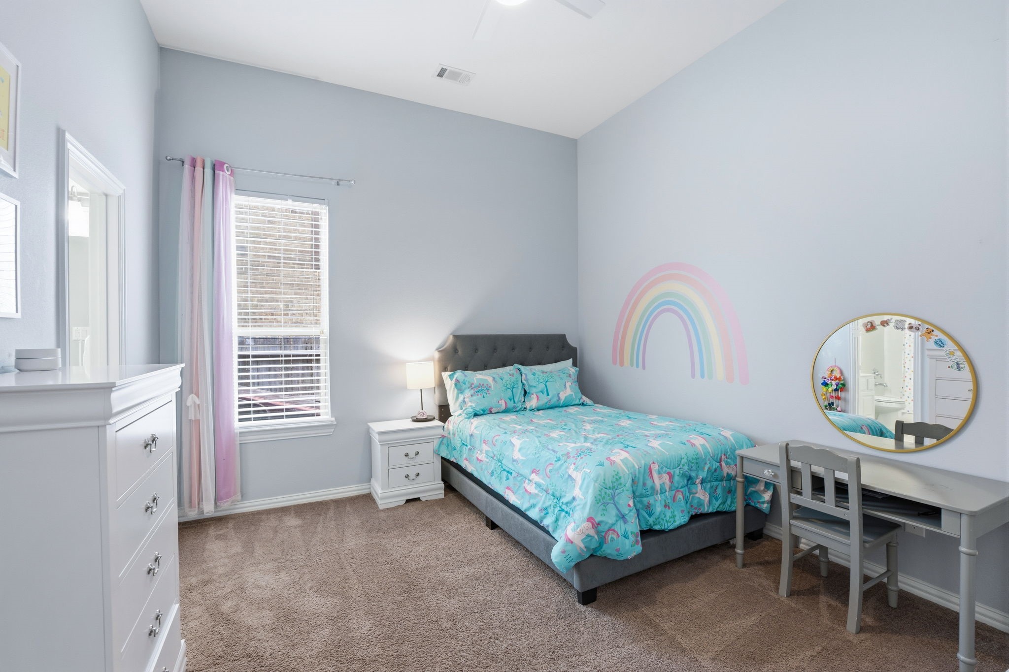 27906 Arden Trail Spring, TX 77386 - Photo 8 of 49 a bedroom with a bed a chandelier and a mirror