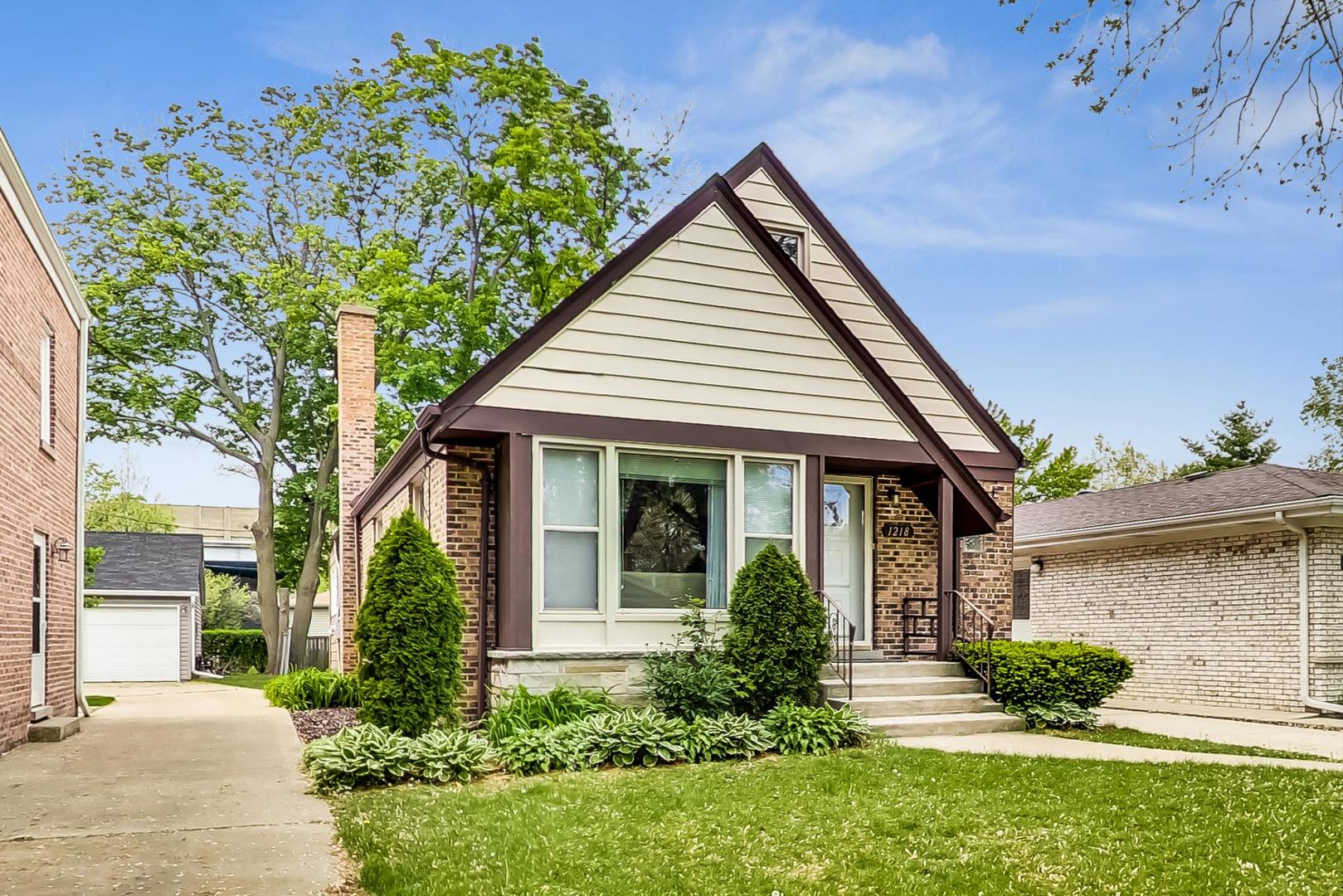 1218 Elliott Street Park Ridge, IL 60068 - Photo 1 of 24 front view of a house with a yard