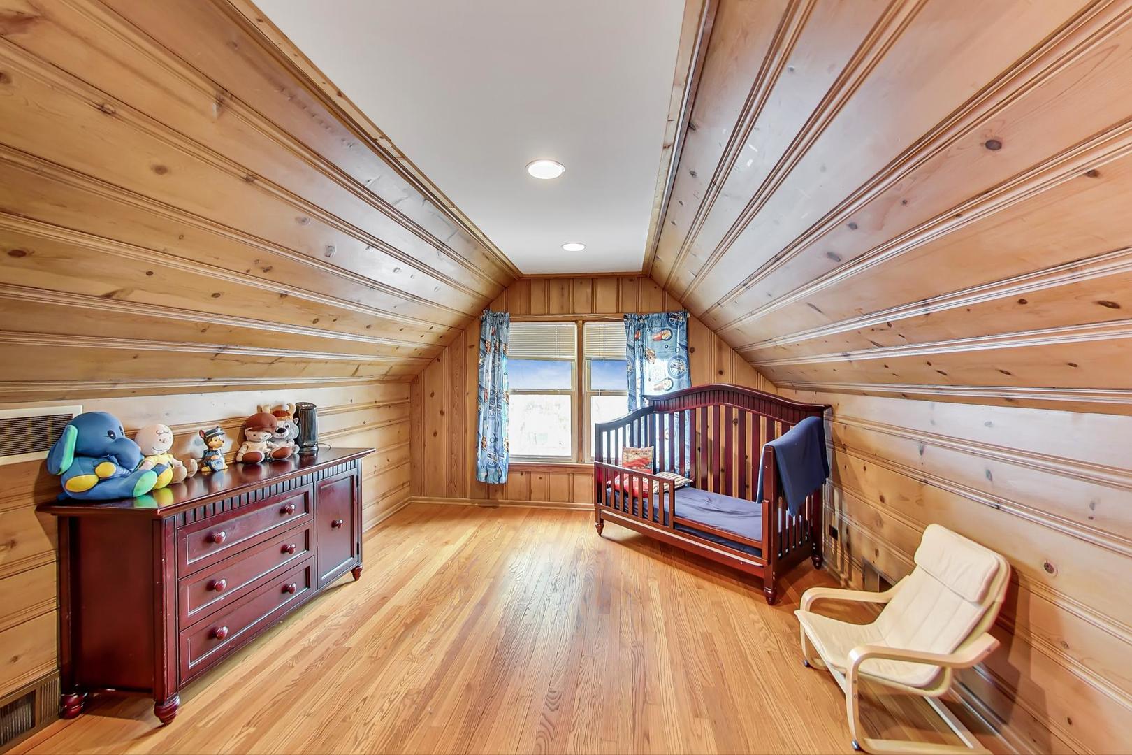 1218 Elliott Street Park Ridge, IL 60068 - Photo 15 of 24 a hallway with a wooden floor and furniture