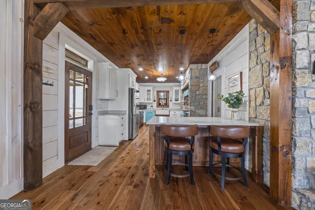 a bedroom with a large bed and a large window