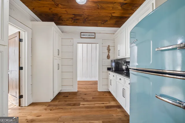 a bedroom with a bed and cabinets