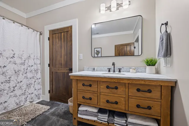 a white toilet sitting next to a bathroom sink