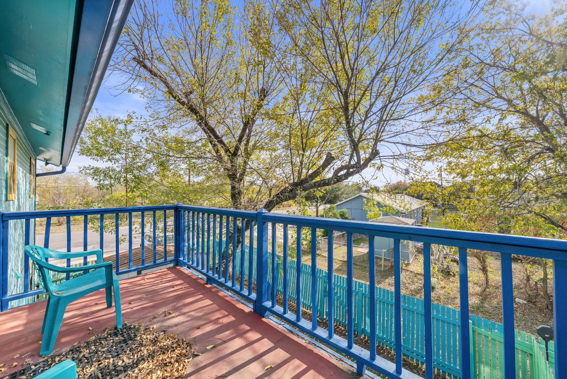 202 West Wheeler Street Manor, TX 78653 - Photo 9 of 28 a balcony with wooden floor and outdoor space