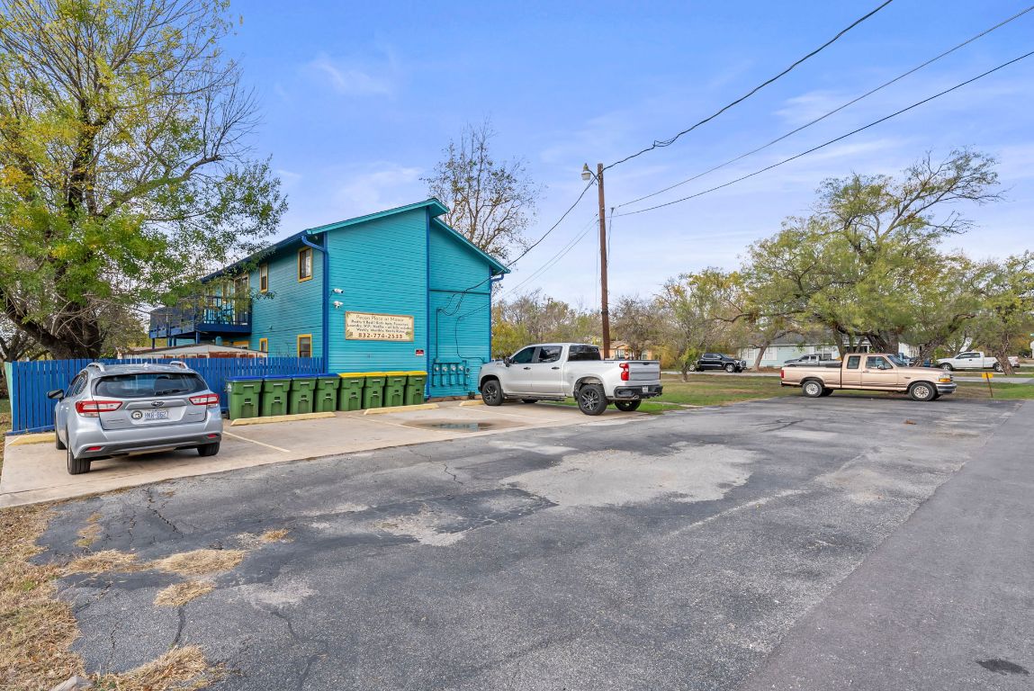 202 West Wheeler Street Manor, TX 78653 - Photo 18 of 28 a view of a cars parked on the side of a street