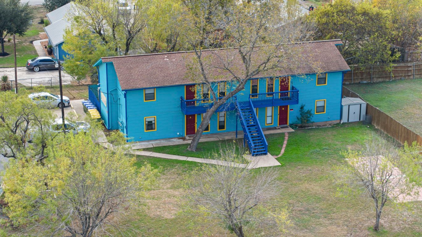 202 West Wheeler Street Manor, TX 78653 - Photo 22 of 28 aerial view of a house with a yard