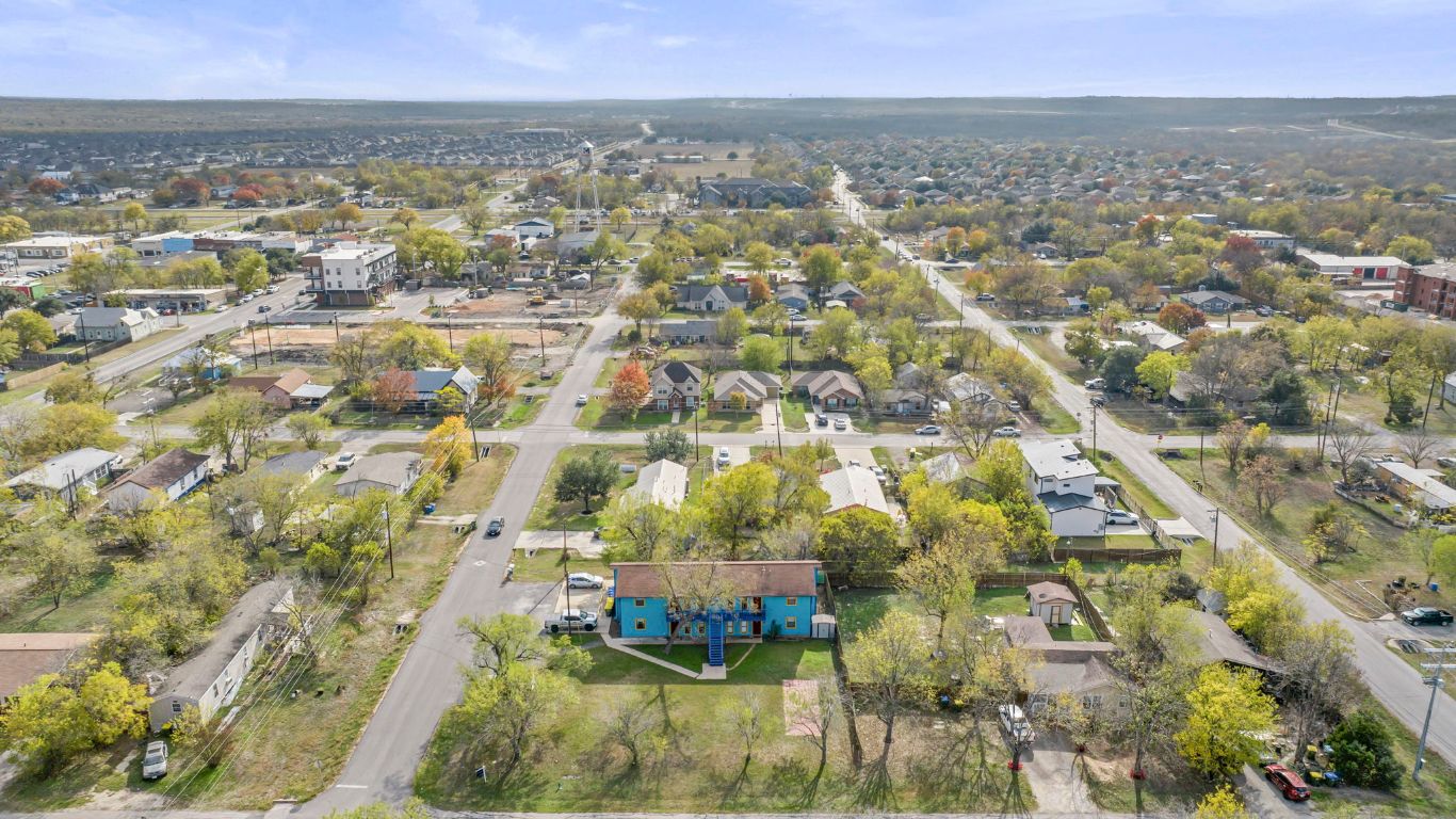 202 West Wheeler Street Manor, TX 78653 - Photo 24 of 28 an aerial view of residential houses with outdoor space
