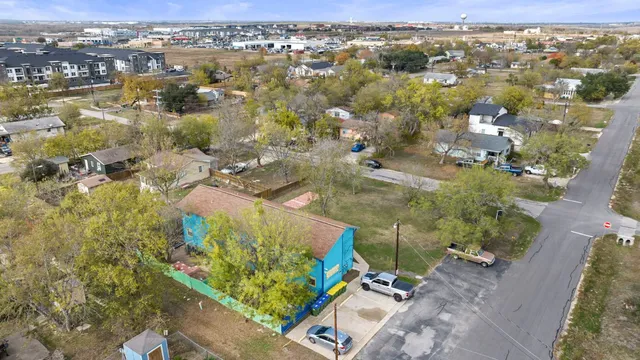 aerial view of a house with a yard