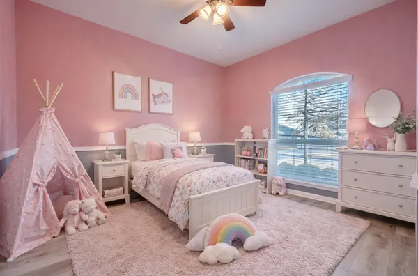 a bed room with a bed and a window