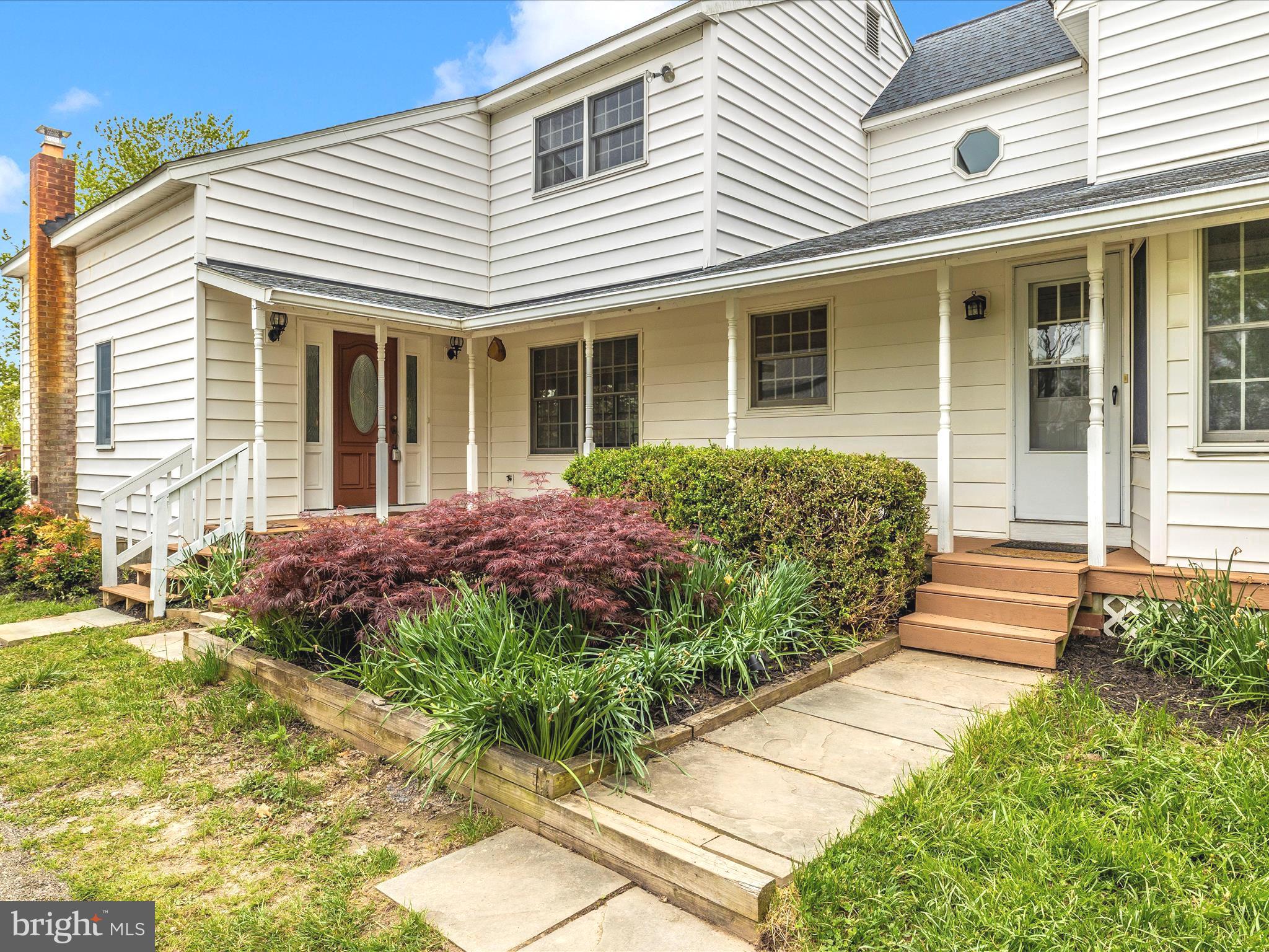 15920 Barnesville Road Boyds, MD 20841 - Photo 49 of 57 a front view of a house with a garden