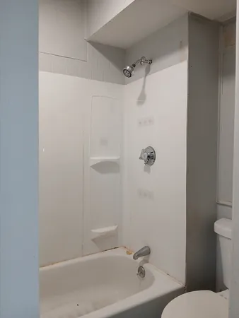 a bathroom with a sink and shower