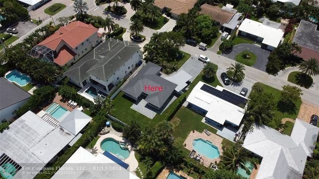 an aerial view of residential house with outdoor space and parking