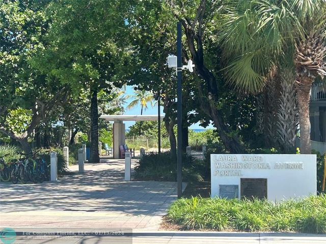 a view of a house with a tree in front