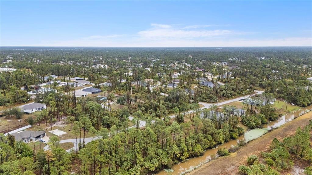 29 Gourmet Road North Port, FL 34288 - Photo 3 of 9 an aerial view of residential building with green space