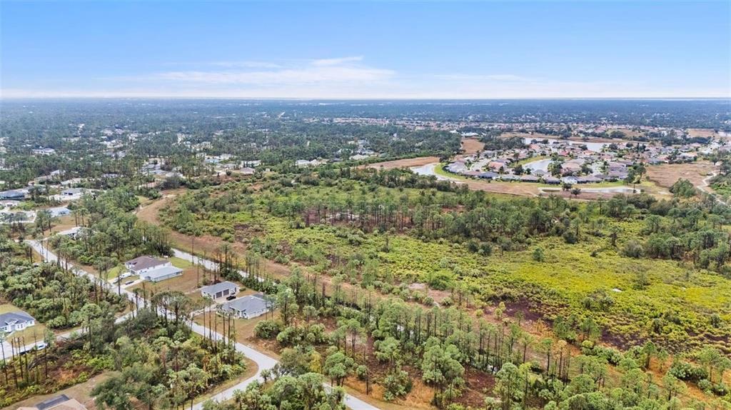29 Gourmet Road North Port, FL 34288 - Photo 5 of 9 an aerial view of residential building and trees