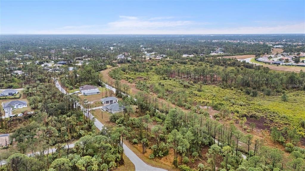 29 Gourmet Road North Port, FL 34288 - Photo 6 of 9 an aerial view of residential house with green space