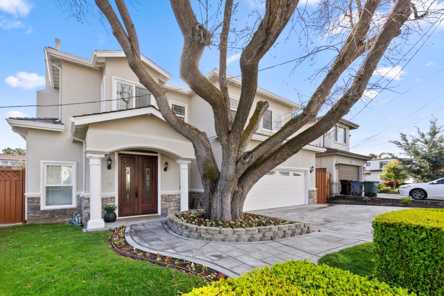 a view of house with yard and entertaining space