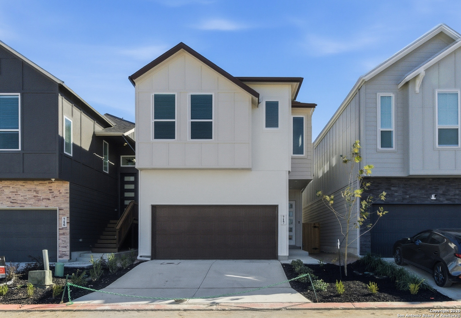 a front view of a house with yard