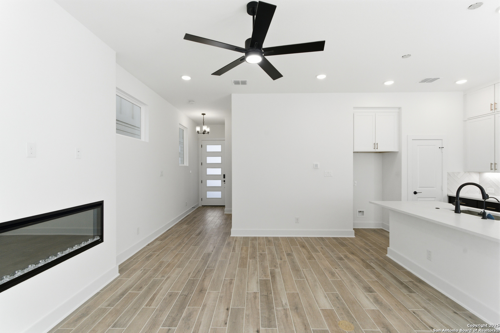 6464 Babcock Road, Unit 717 San Antonio, TX 78249 - Photo 12 of 44 a view of a kitchen with a sink and wooden floor