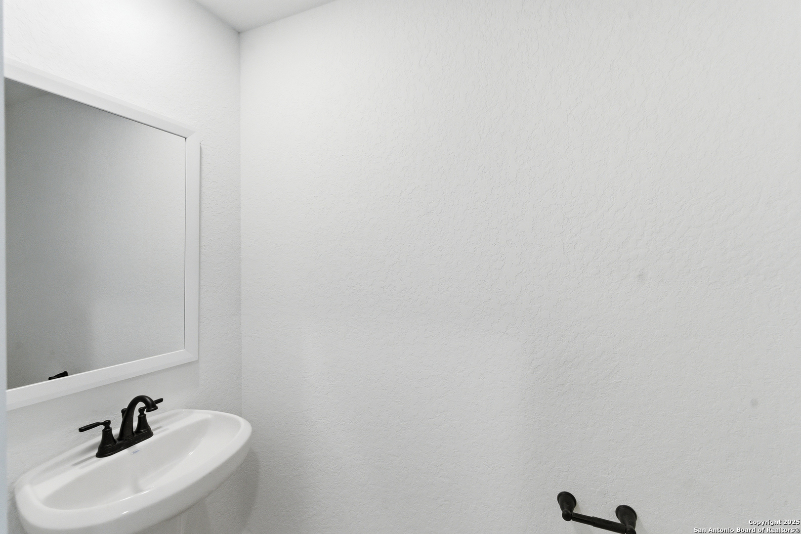 6464 Babcock Road, Unit 717 San Antonio, TX 78249 - Photo 21 of 44 a bathroom with a sink and mirror