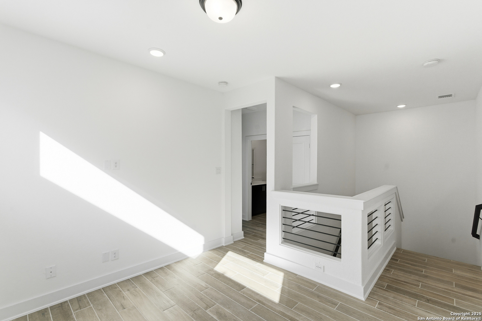 6464 Babcock Road, Unit 717 San Antonio, TX 78249 - Photo 26 of 44 a view of a hallway with staircase