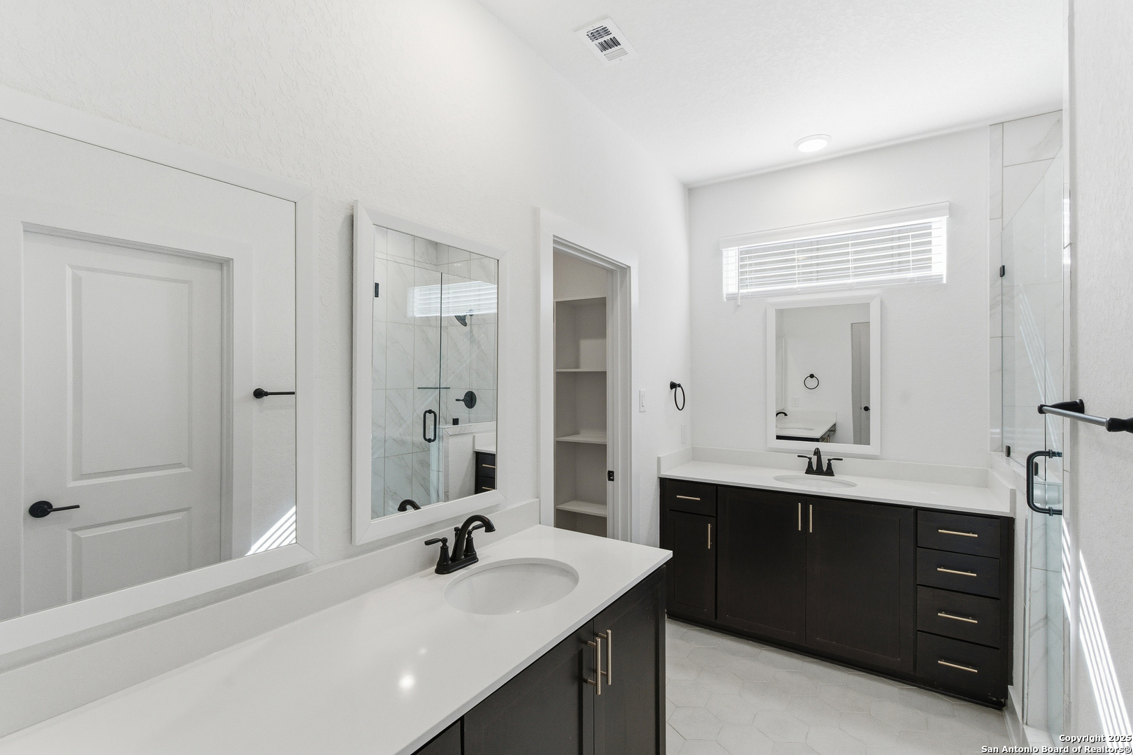 6464 Babcock Road, Unit 717 San Antonio, TX 78249 - Photo 30 of 44 a bathroom with a sink double vanity granite tub shower and a mirror