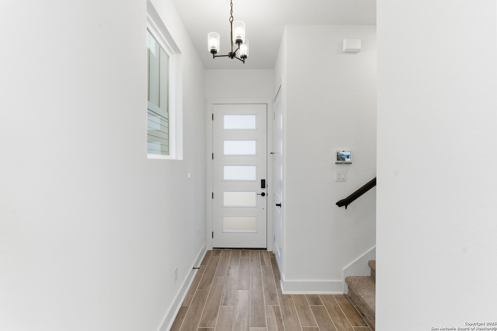 6464 Babcock Road, Unit 717 San Antonio, TX 78249 - Photo 7 of 44 a view of a hallway with wooden floor and closet
