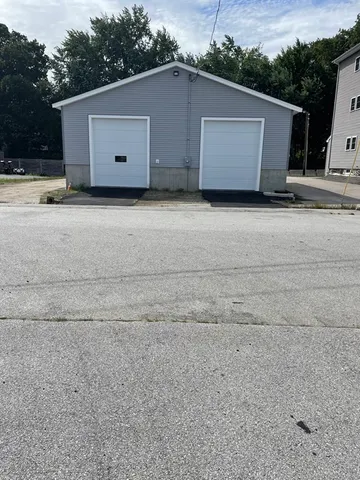 a view of road with card parked on side of road