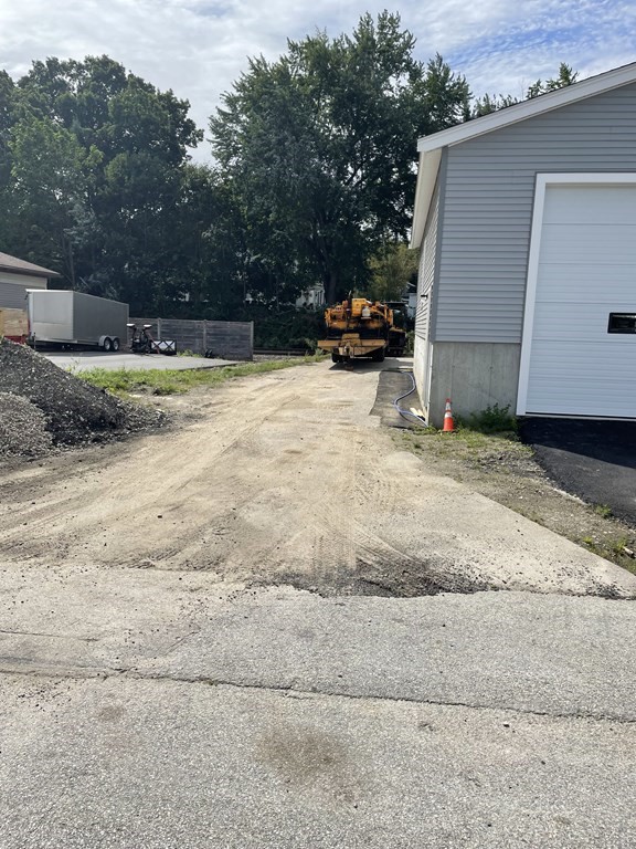 16 Dexter Street Worcester, MA 01607 - Photo 3 of 17 a view of road with card parked on side of road