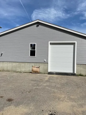 a view of parking area and car parked