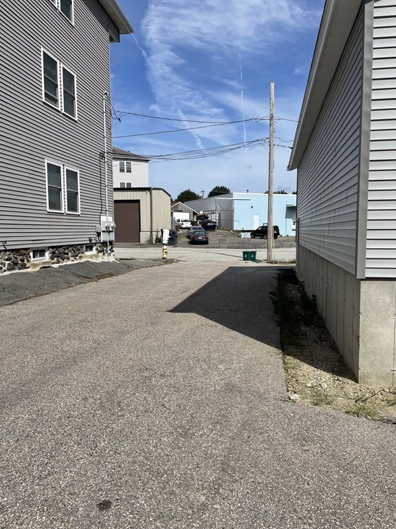 16 Dexter Street Worcester, MA 01607 - Photo 6 of 17 a view of parking area and car parked
