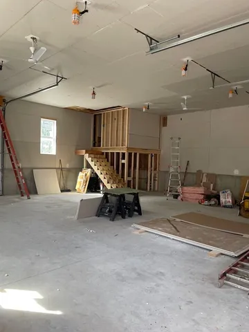 a living room with a couch and a window