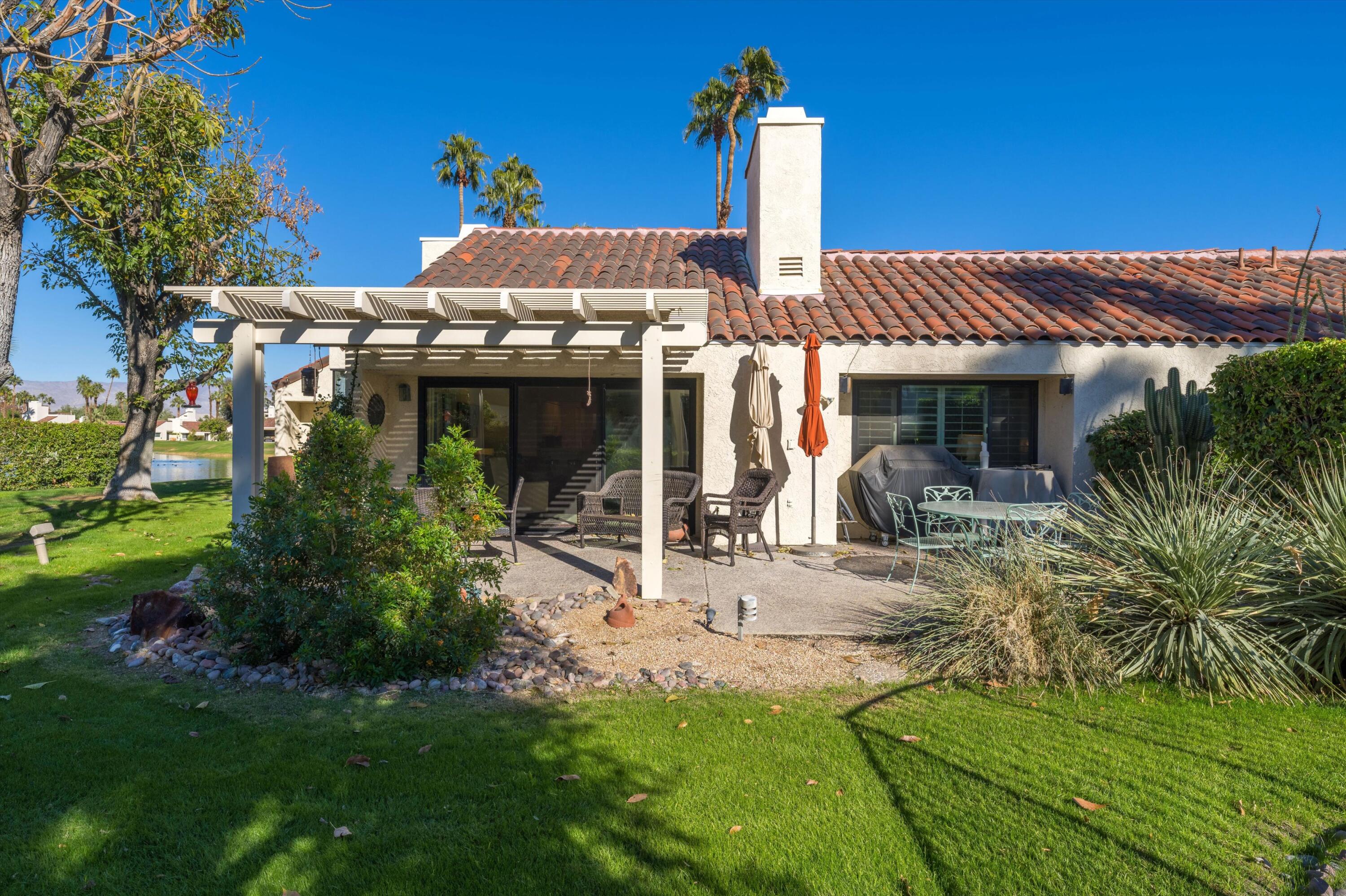 464 Sunningdale Drive Rancho Mirage, CA 92270 - Photo 18 of 47 a view of a house with garden