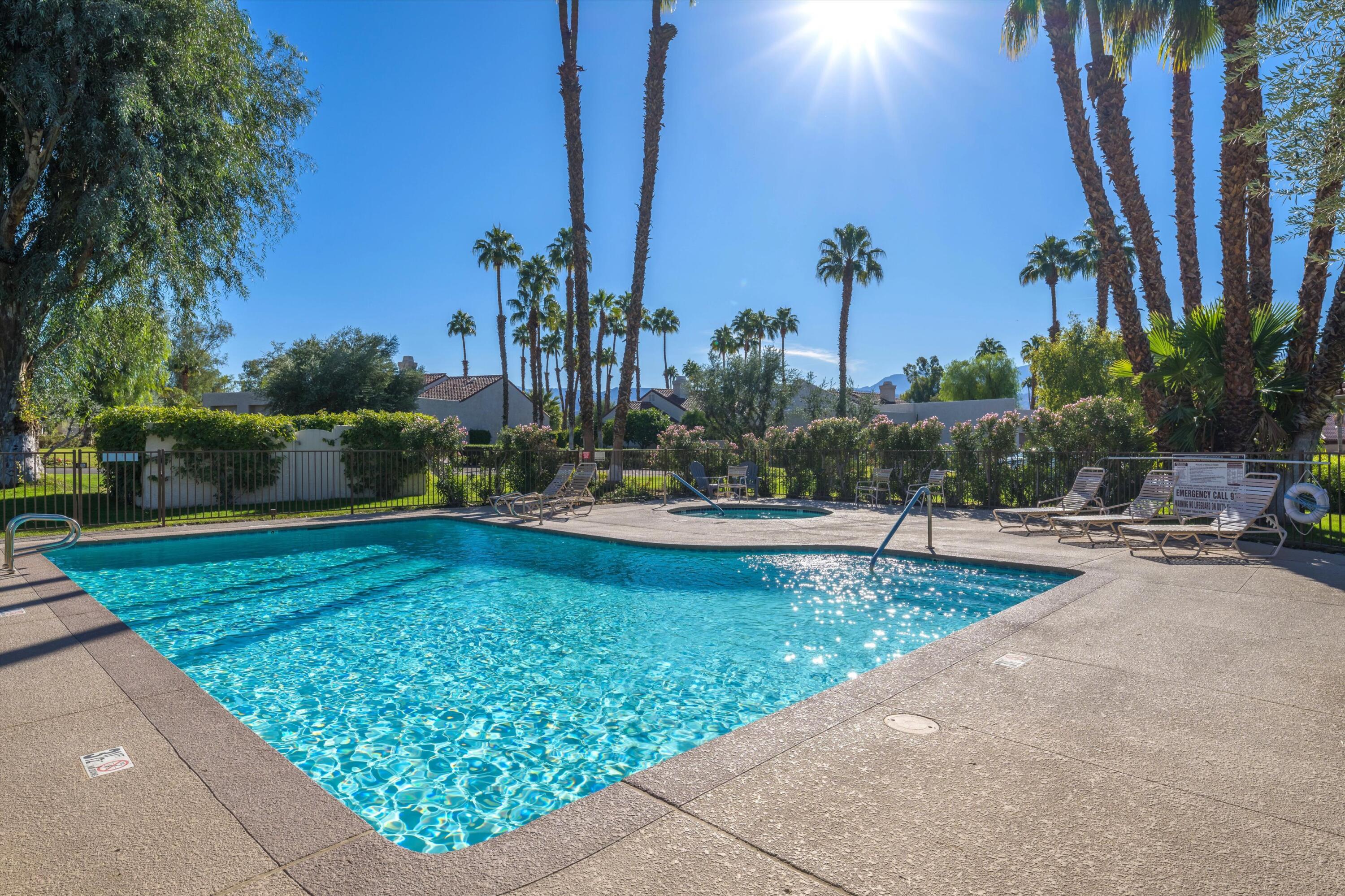464 Sunningdale Drive Rancho Mirage, CA 92270 - Photo 20 of 47 a view of a swimming pool with a patio