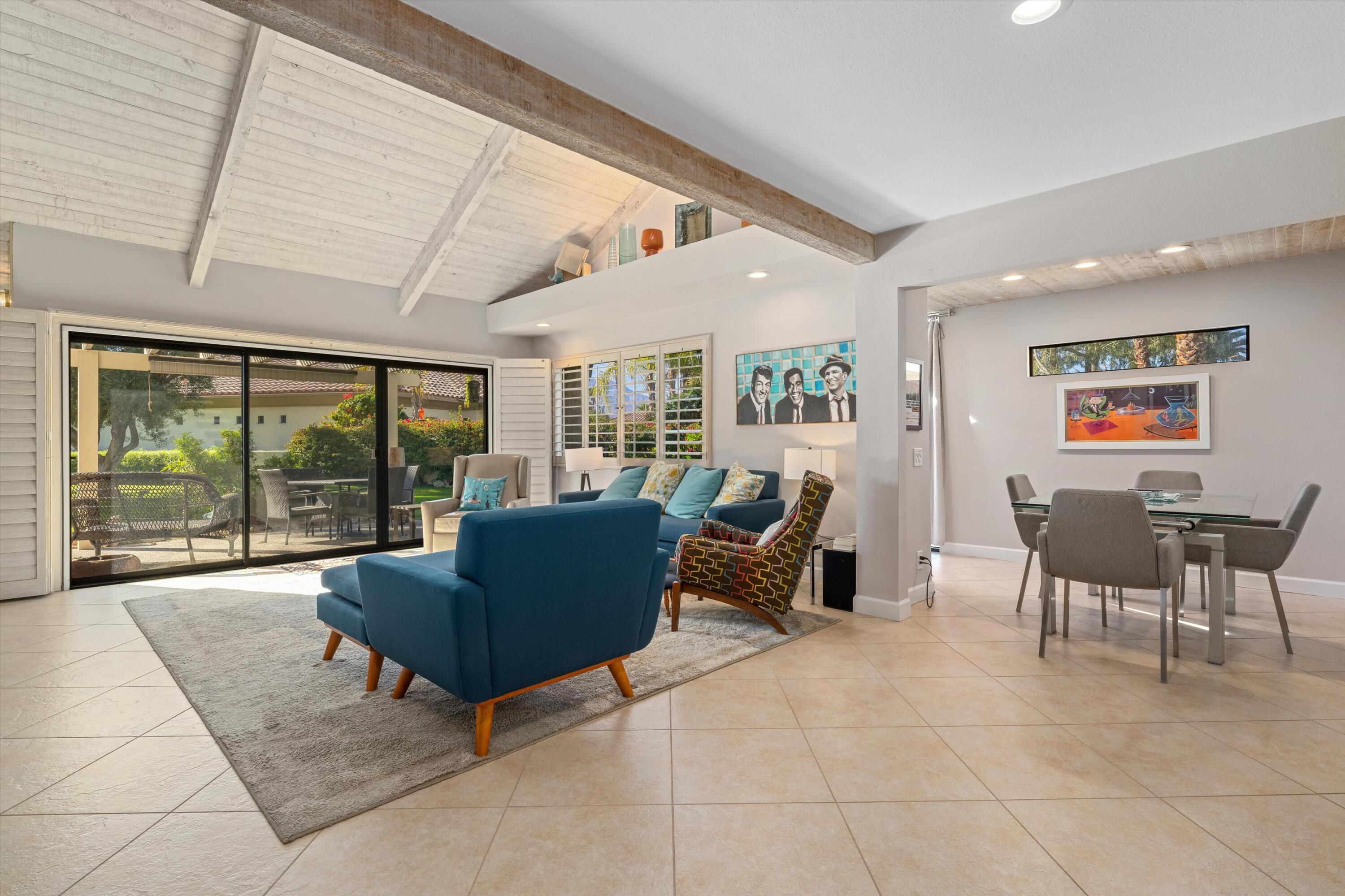 464 Sunningdale Drive Rancho Mirage, CA 92270 - Photo 23 of 47 a living room with furniture and a floor to ceiling window
