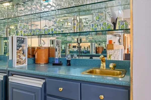 a kitchen with a sink and a large window