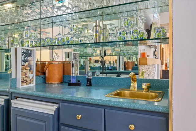 a kitchen with a sink and a large window