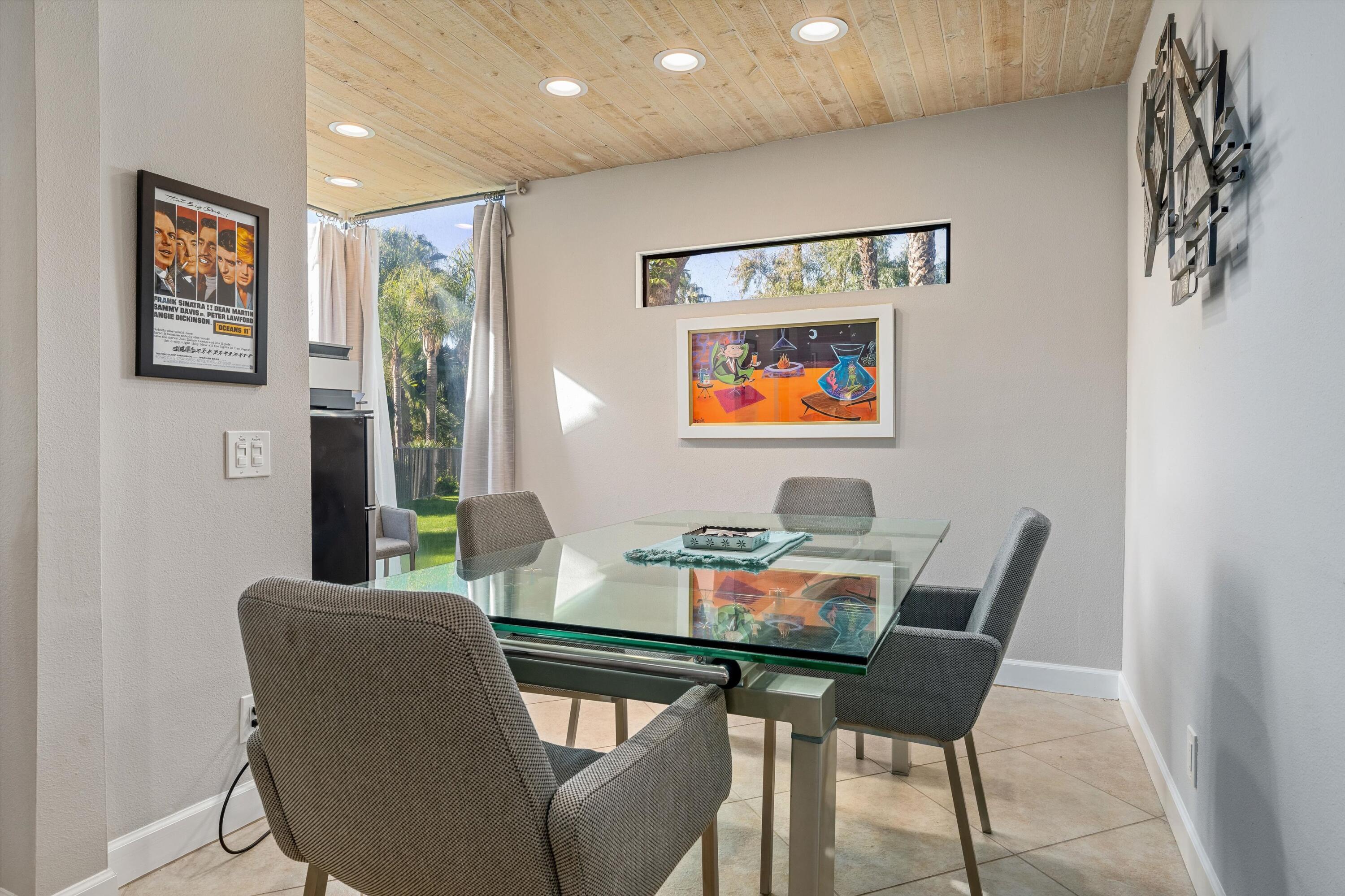 464 Sunningdale Drive Rancho Mirage, CA 92270 - Photo 30 of 47 a dining room with furniture and window
