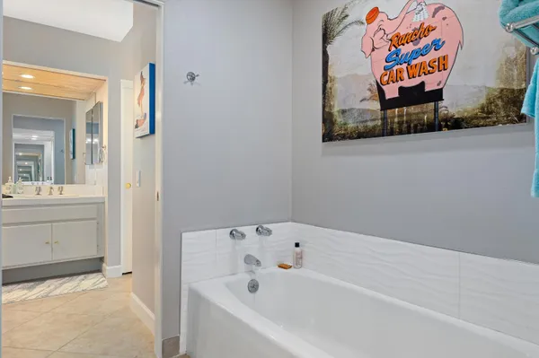 a bathroom with a bathtub and sink