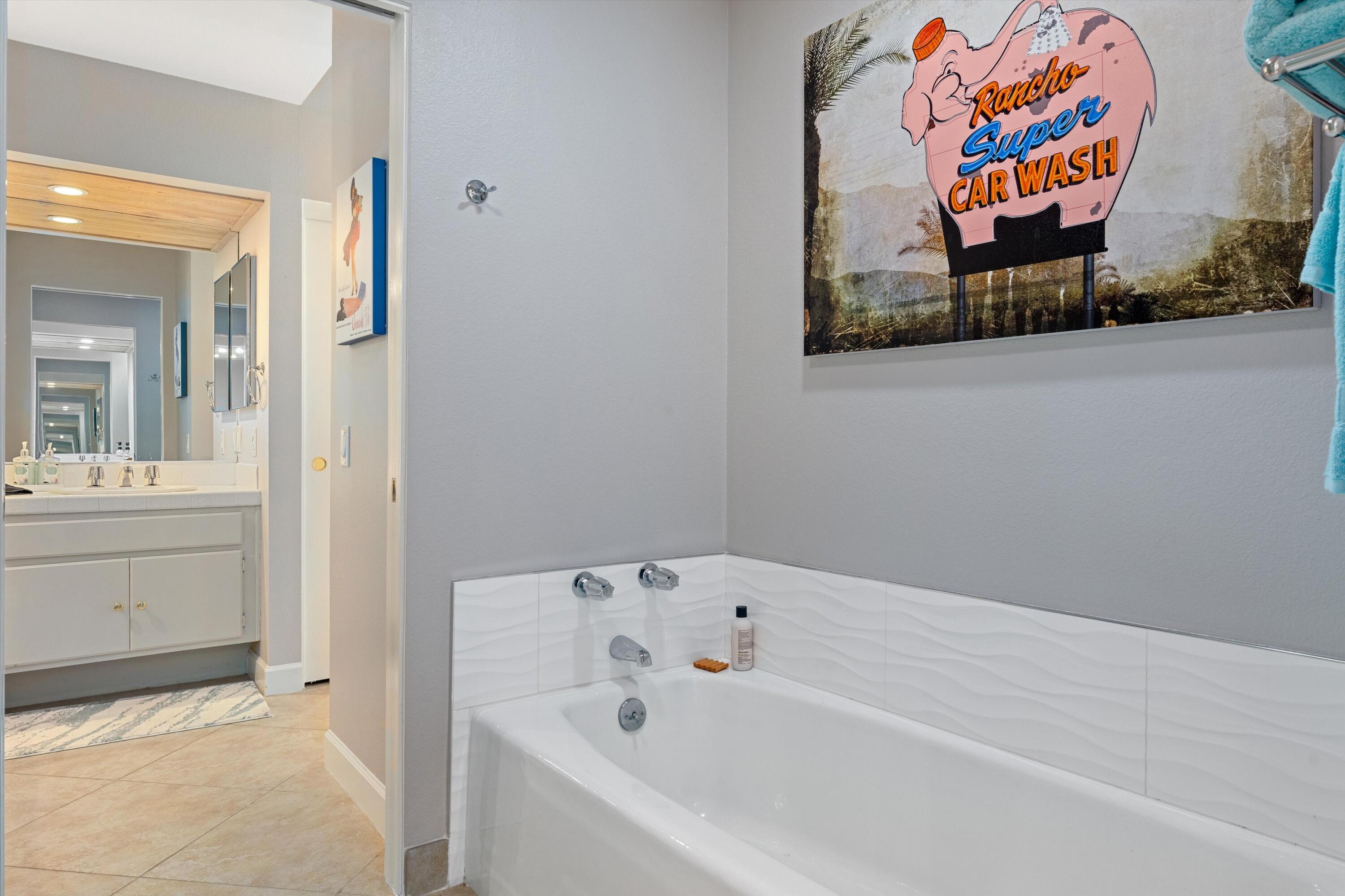 464 Sunningdale Drive Rancho Mirage, CA 92270 - Photo 39 of 47 a bathroom with a bathtub and sink