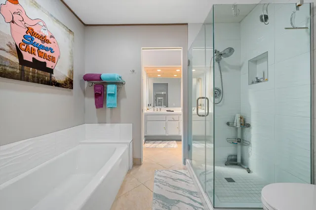 a bathroom with a tub and shower