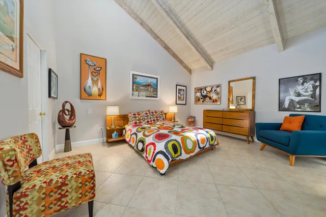 a bedroom with furniture and window