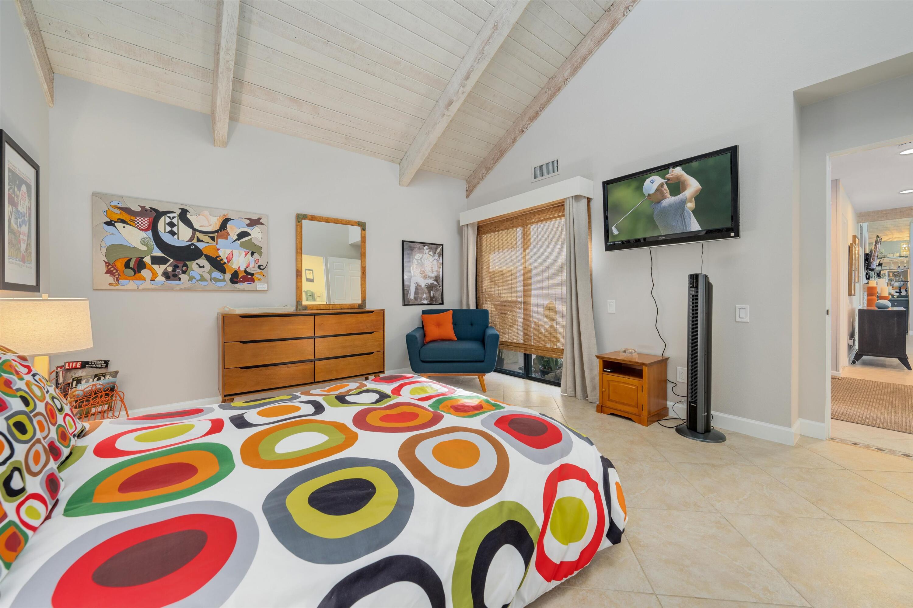 464 Sunningdale Drive Rancho Mirage, CA 92270 - Photo 46 of 47 a bedroom that has a bed and a table in it