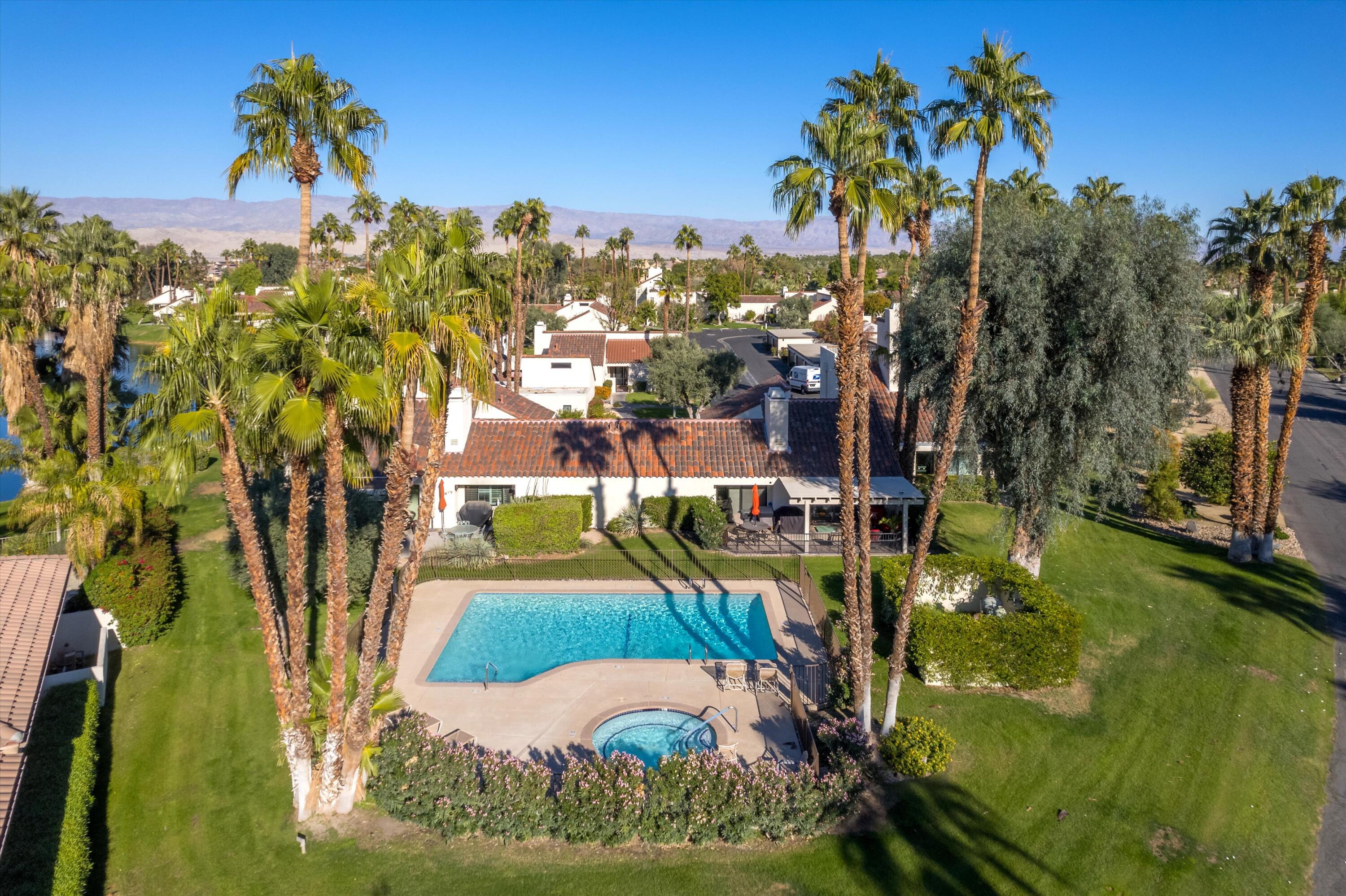 464 Sunningdale Drive Rancho Mirage, CA 92270 - Photo 7 of 47 a view of a swimming pool with a yard