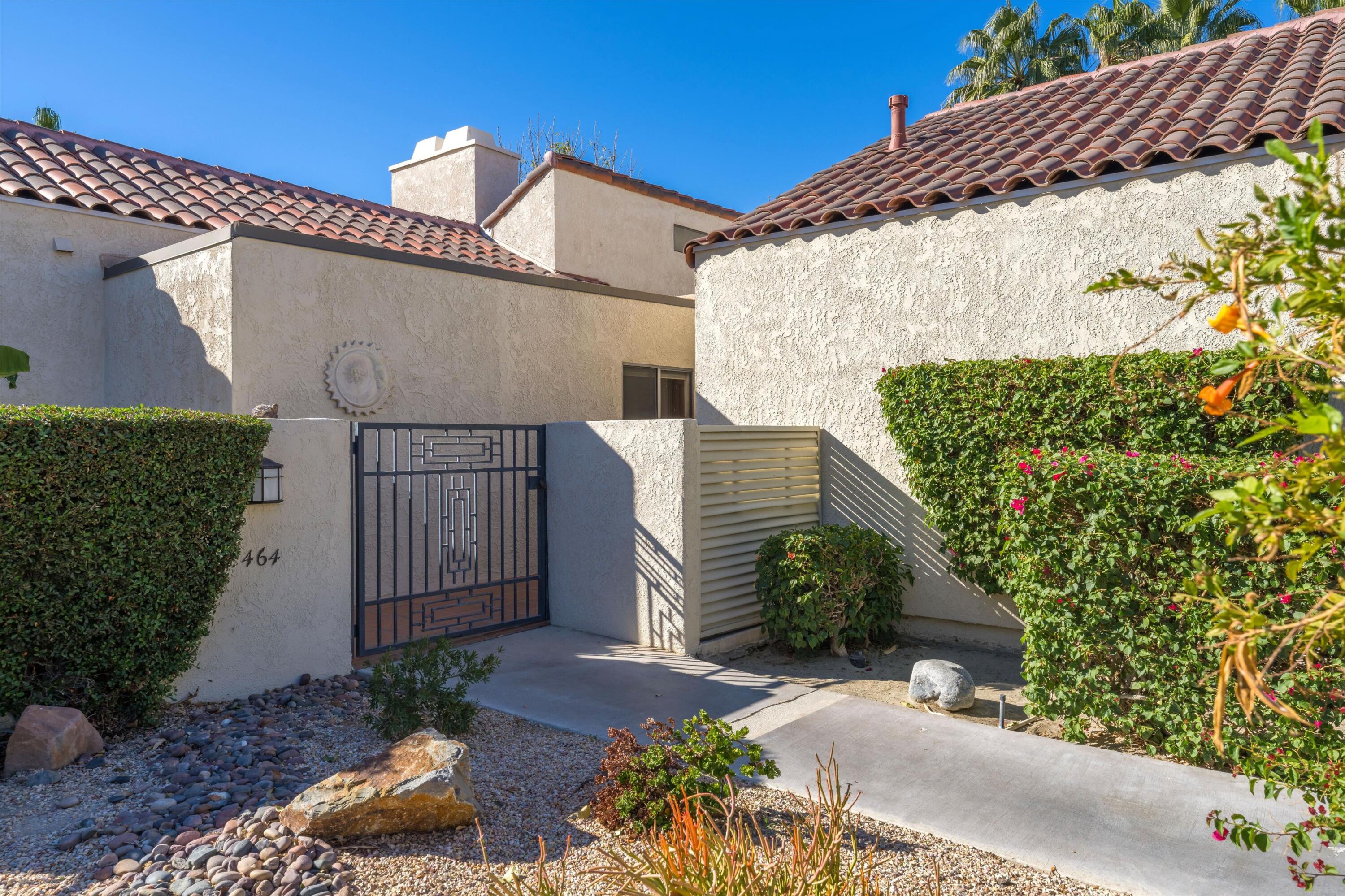 464 Sunningdale Drive Rancho Mirage, CA 92270 - Photo 10 of 47 a view of a house with a street