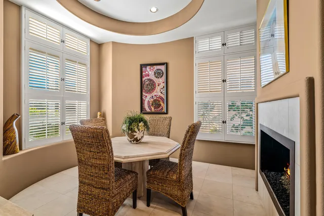 a kitchen with counter top space and living room view