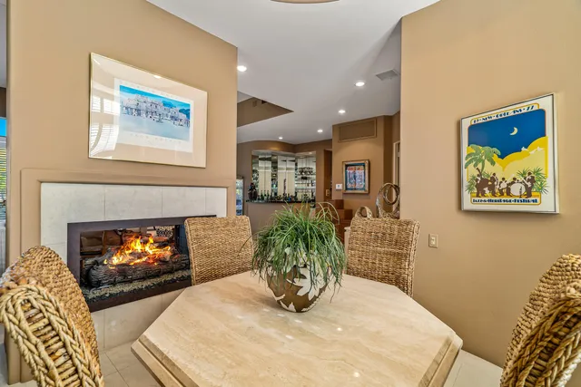a view of a dining room with furniture large window and outside view